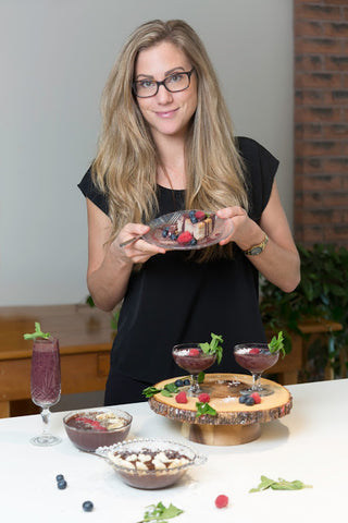 Photo of Kat Bodkin Tyrell holding açaí cheesecake