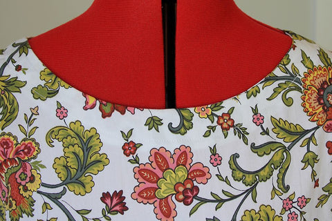 Neck facing sewn all around the neckline