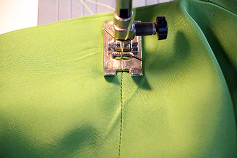 Stitch in the ditch to secure the facing at the shoulder seam