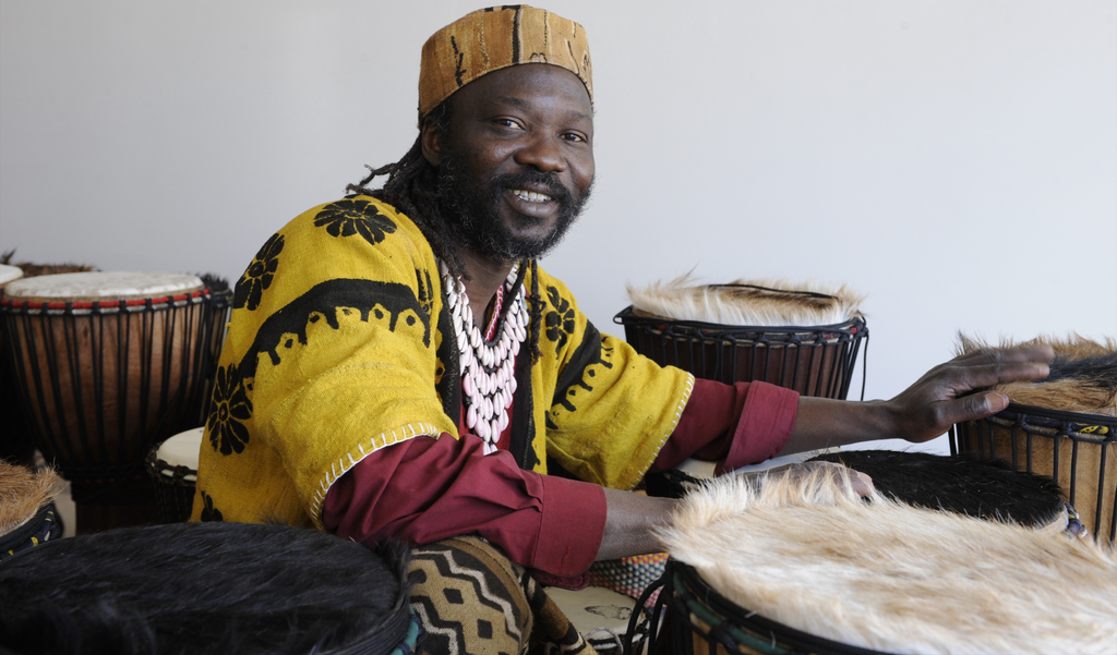 Photo of Mady Keita inside African drum shop