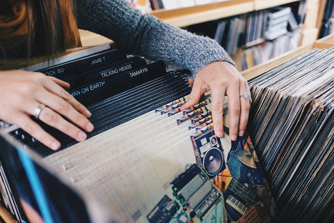 A women looking through a pile of records