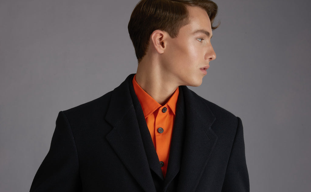 Luxury mens fashion black and orange suits, hunting jackets, breeches, military fashion elements, designer fashion and bespoke tailoring made in Berlin