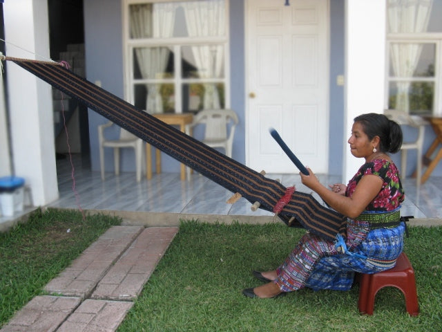 Side view showing the complete set up of a backstrap loom with Master Weaver Cristina Hernandez