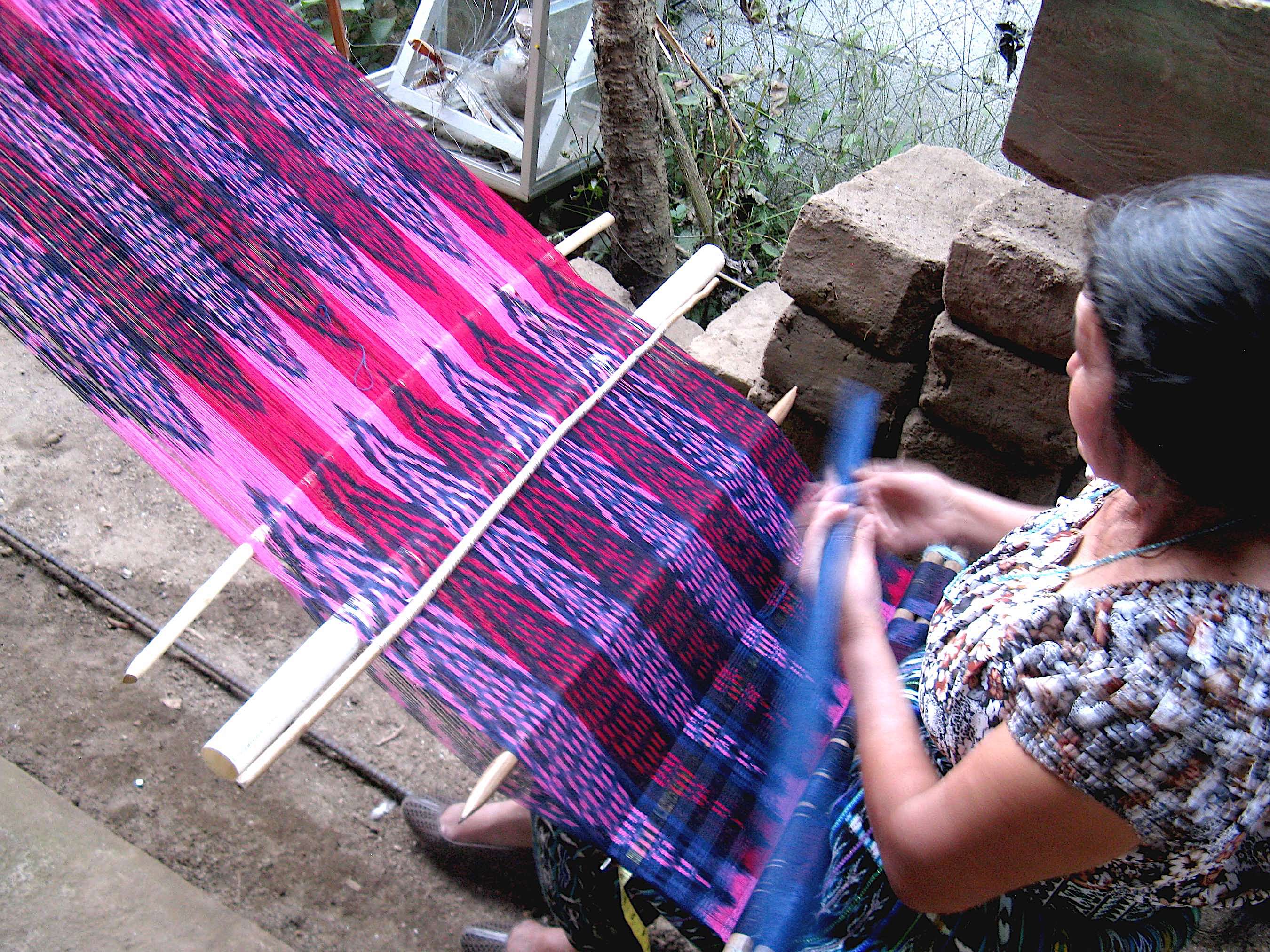 Master mayan master weaver julia francisca cholotío toc working on a reverse ikat backstrap loom shawl