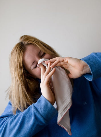 Woman Sneezing with Handkerchief