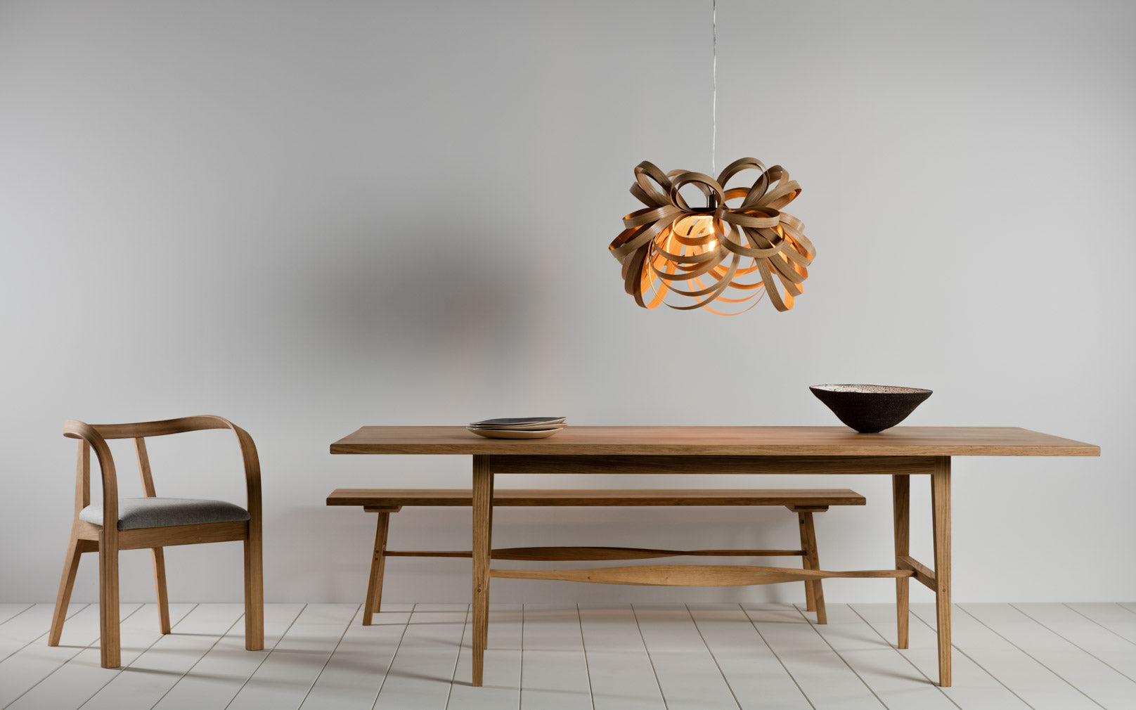 Tom Raffield Arbor Dining Chair, Butterfly pendant above Treave table