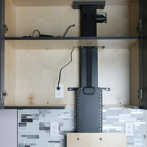 Fully extended Touchstone WhisperLift II Motorized Lift in a kitchen cabinet