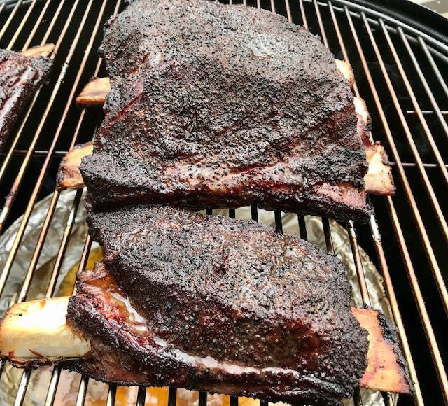 cooked beef short ribs on a smoker
