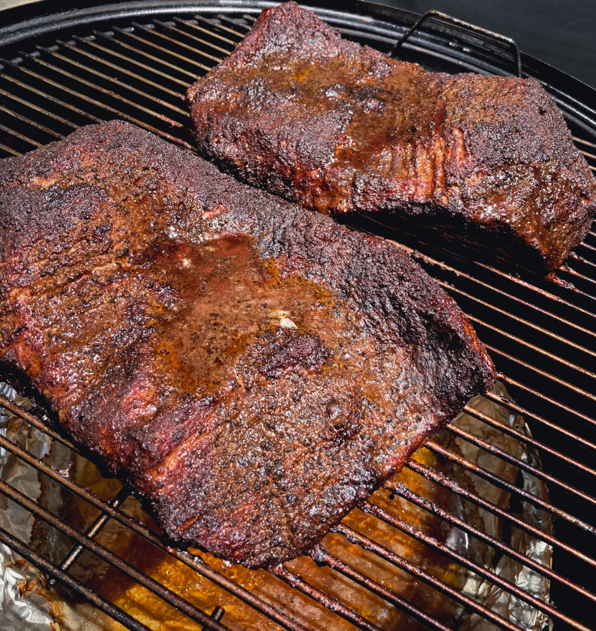 Photo of fully cooked briskets on a smoker