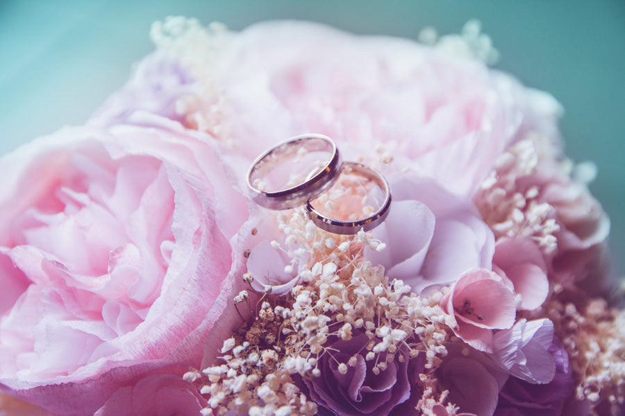 couple rings on a flowers