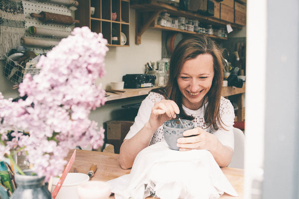 Katie Robbins creating porcelain pieces in her studio