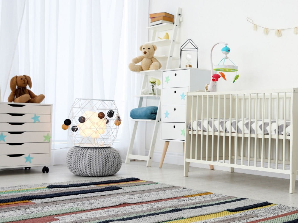 Baby's nursery with neutral white furniture