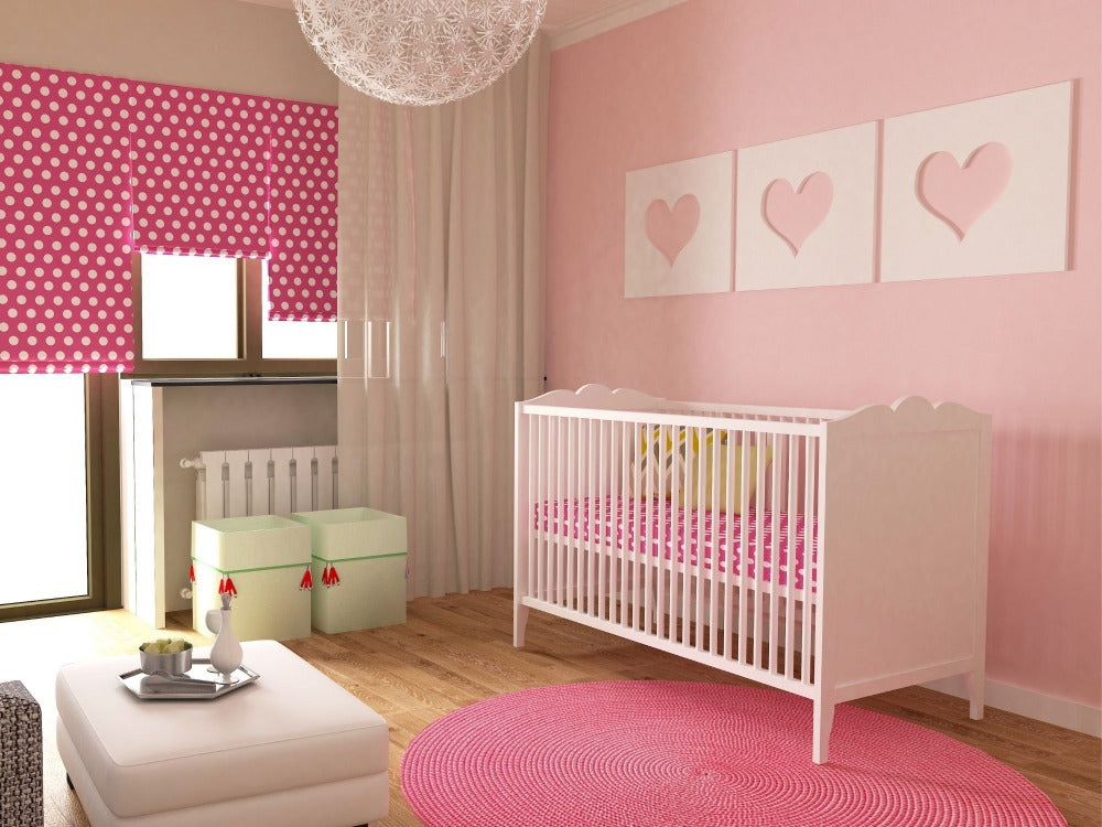 Baby's nursery with pink decor theme