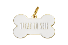 A light colored dog tag that says "Treat Yo Self" | Bubu Brands