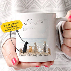 15 Perfect Gifts to get a Dog Lover | White mug with 5 different cartoon dogs all facing away from the camera looking out at the water | Bubu Brands