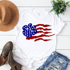 A distressed american paw shirt on a bright background with blue jeans brown boots and a brown hat | Bubu Brands