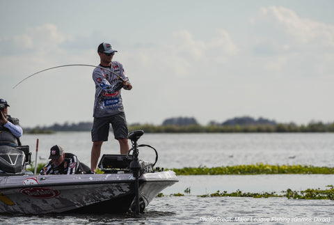 Jordan Lee casts into a grass mat on Lake Garcia