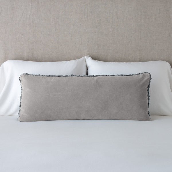 lumbar pillow on bed