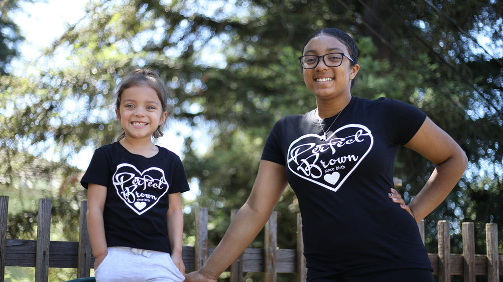 african american sisters happy smiling wearing black perfect brown t-shirts