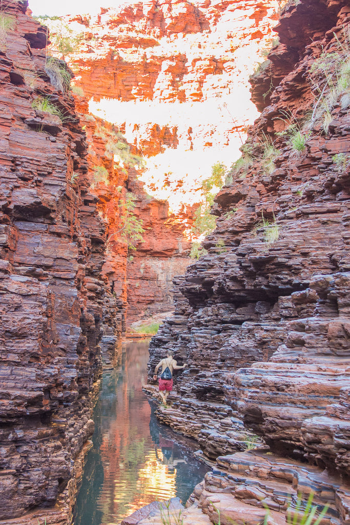 mike walking through a very steep but narrow gorge 