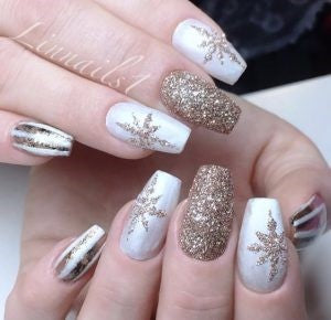 Golden snowflake patch nail design
