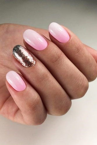 Pink and gold glitter ombre nail design