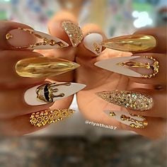 Metallic stiletto Gold Nail Designs