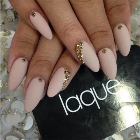 These pretty nude nails have the perfect amount of glam for everyday