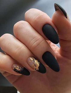 Black matte nails with a bit of gold glitter