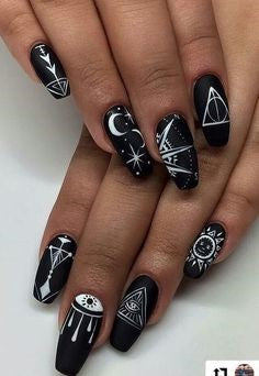 Black nail design painted by white logo