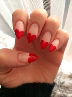 Red heart stiletto nail design