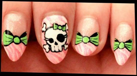 Skull And Bow Design On Pink Zebra Nails
