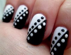Spotty black and white nail design