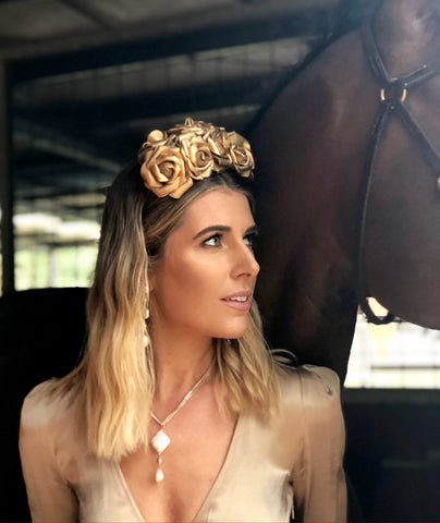 Image of Georgi Connolly at Jason Warren Racing wearing Leoni & Vonk jewellery and Murley & Co millinery