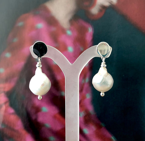 Leoni & Vonk Verity Pearl Earring photographed against a magazine page