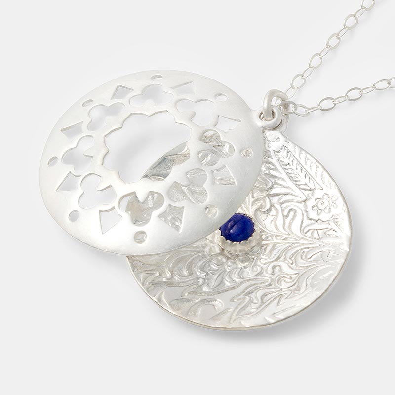 Mandala pendant in sterling silver and a lapis lazuli gemstone.