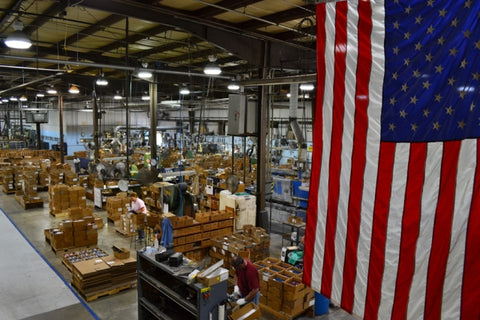 A day at RADA Manufacturing's factory in Waverly, Iowa as our employees work with an American flag in the foreground to the right