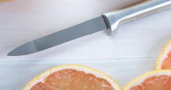 Rada Cutlery's Grapefruit Knife with several slices of grapefruit lying below
