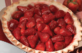 A full pie crust of freshly sliced strawberries