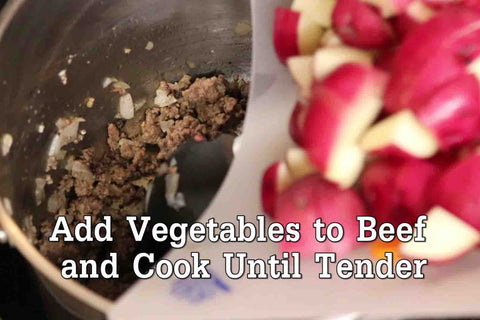 Next, add veggies to your stovepot and cook until tende