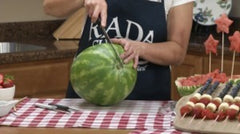 Kristi slicing a large watermelon with the RADA Ham Slicer