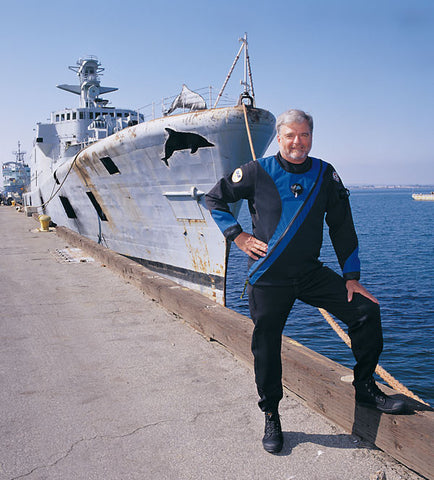 Dick Long standing in front of the Yukon