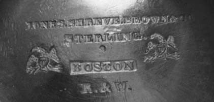 Fig. 2. Marks underneath one teapot, including the incuse R. & W. maker's mark of Rogers & Wendt. The R. & W. mark has been observed with and without Boston and with and without a retailer's mark