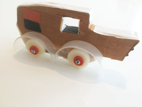 Image of Toy Car that I helped my son build from his sketch, scrap wood and random hardware