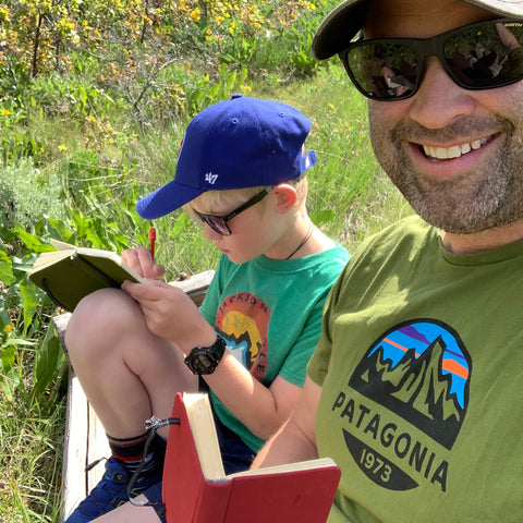 image of my son and I sketching a landscape