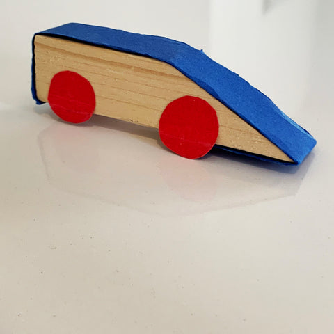  simple home made car made from a scrap wood and colored construction paper