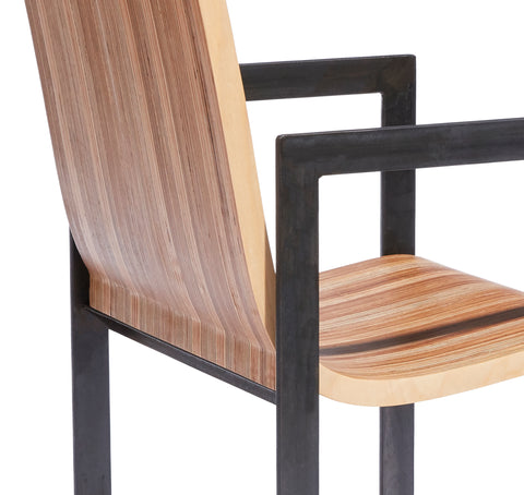detailed view of the Eric Jacoby Design Tectonic Armchair illustrating the natural patinas of the steel frame and the wood seat