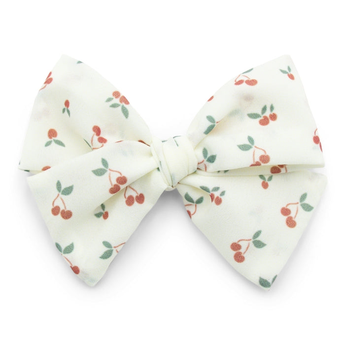 The Kindred Studio cherries midi bow against white backdrop