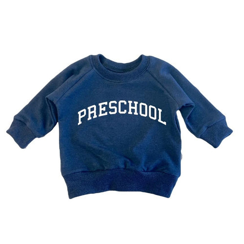 Portage and Main Navy preschool sweatshirt against white backdrop