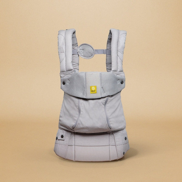 LÍLLÉbaby stone complete all season carrier against beige backdrop